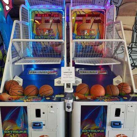 Two side-by-side arcade basketball games